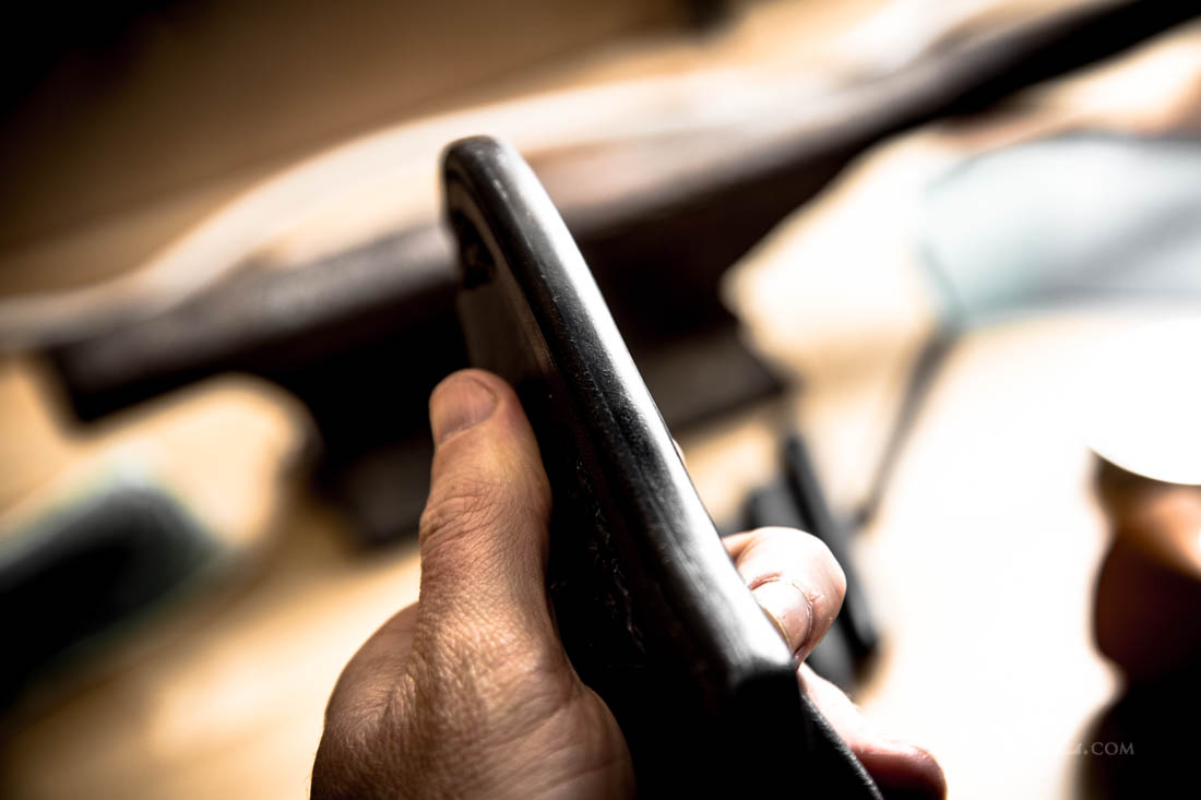 hand burnished and slicked edges on a leather knife sheath