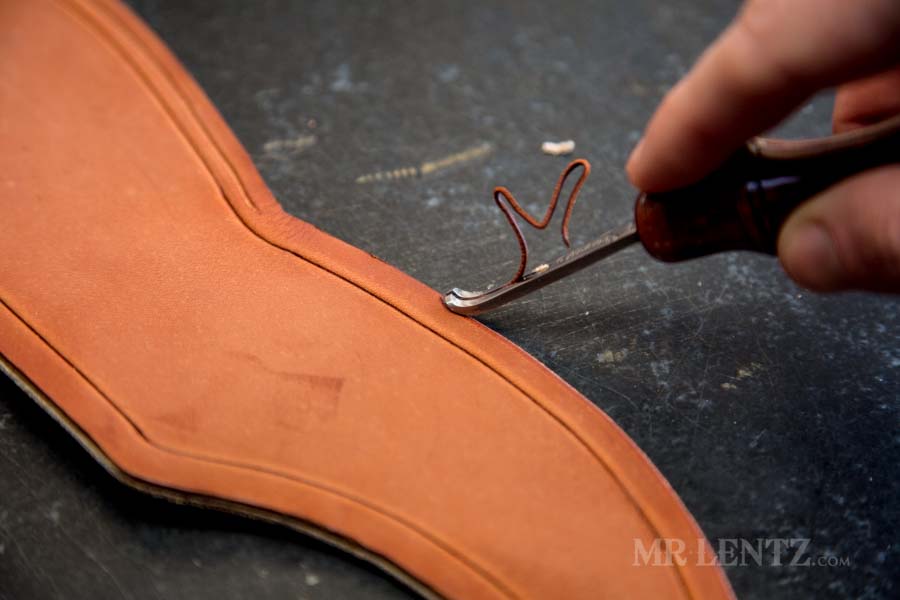 beveling the edge of an ax sheath