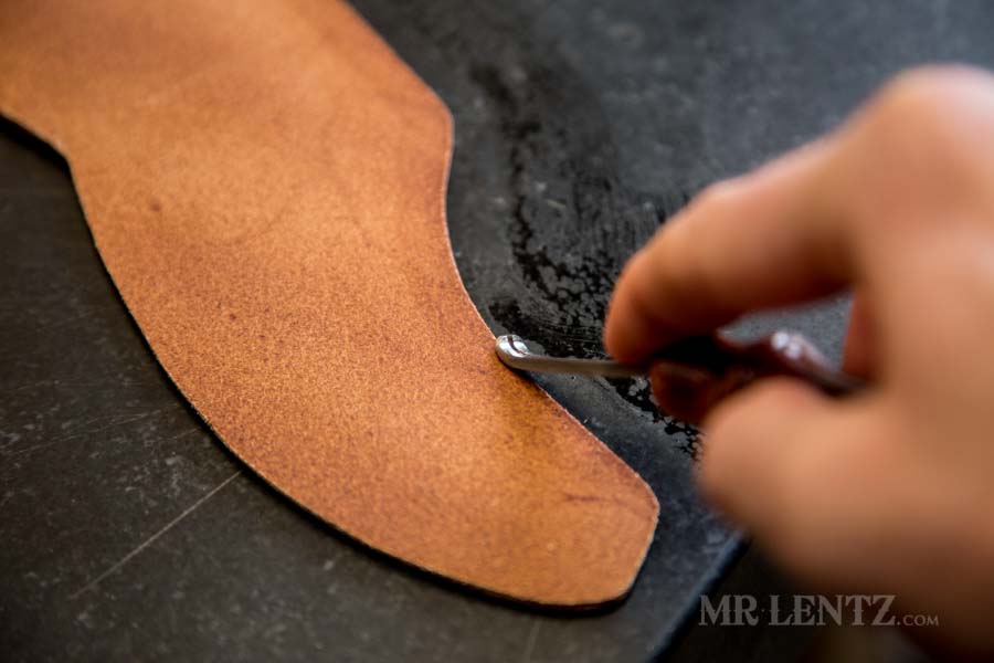 beveling the edge of an ax sheath