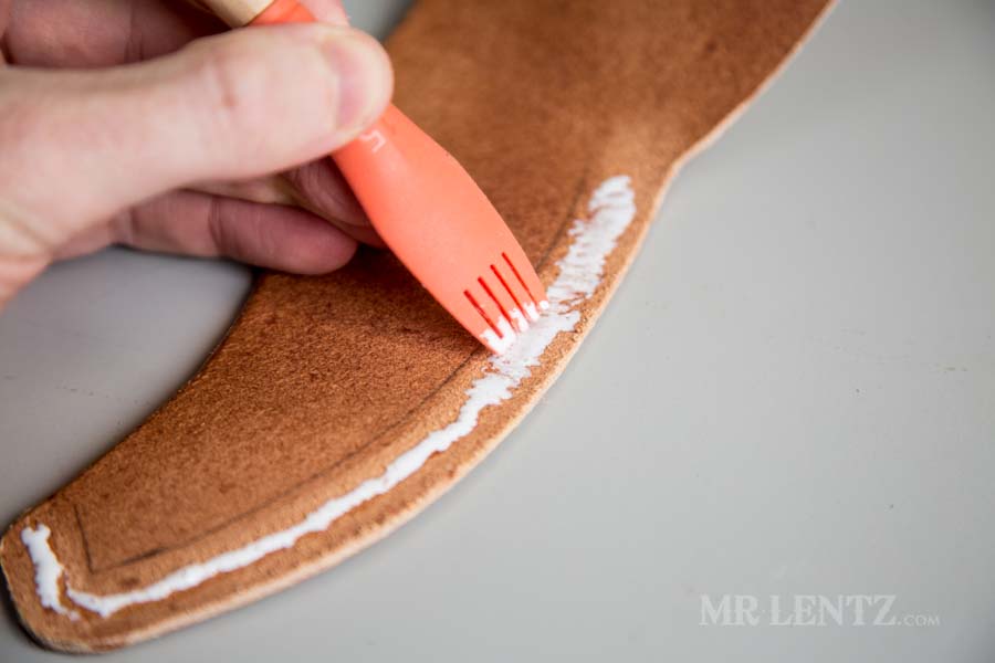 spreading glue on axe sheath