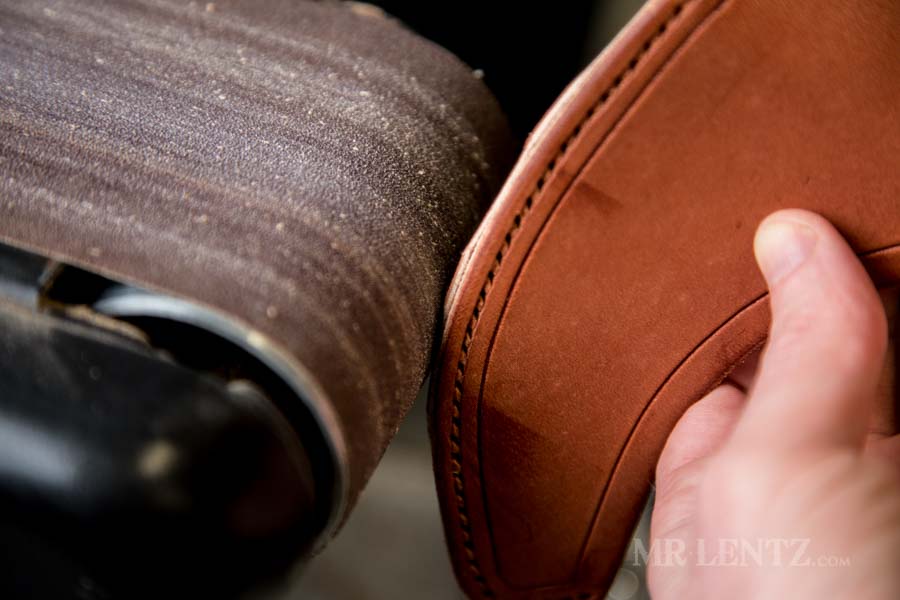 sanding the edge smooth on axe sheath
