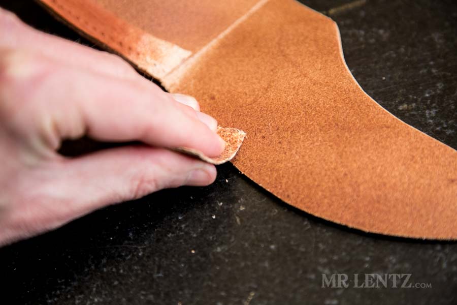sanding interior edge of axe sheath