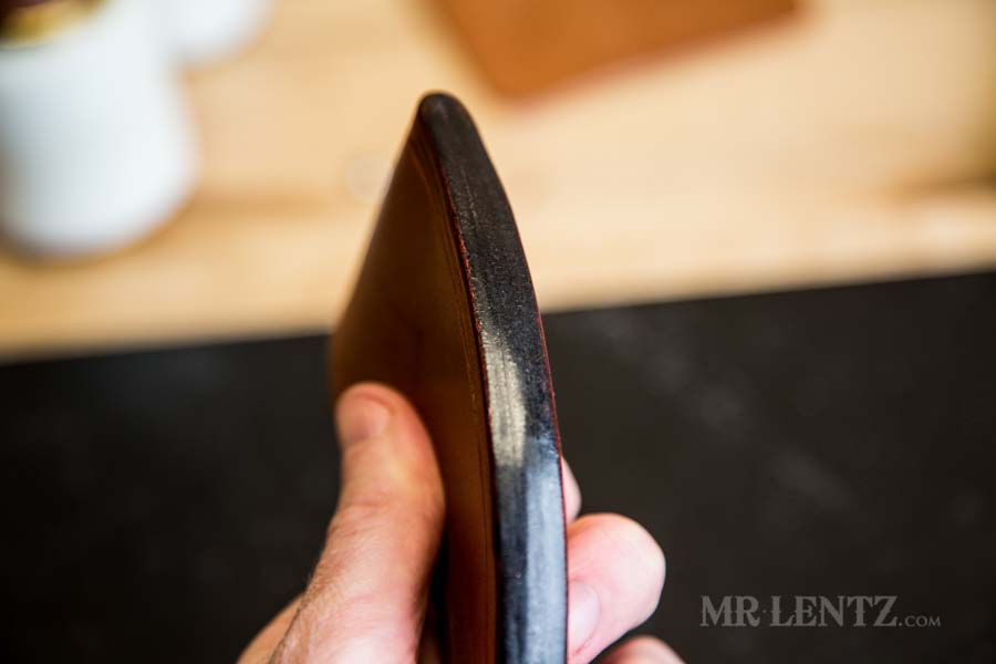 slicked edge of sheath for axe