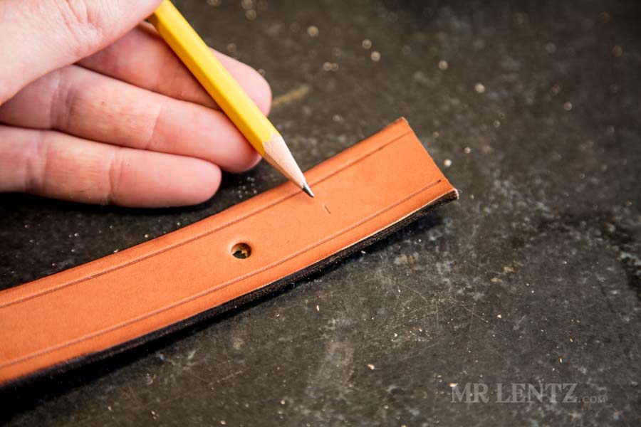 marking the tip of the retaining strap