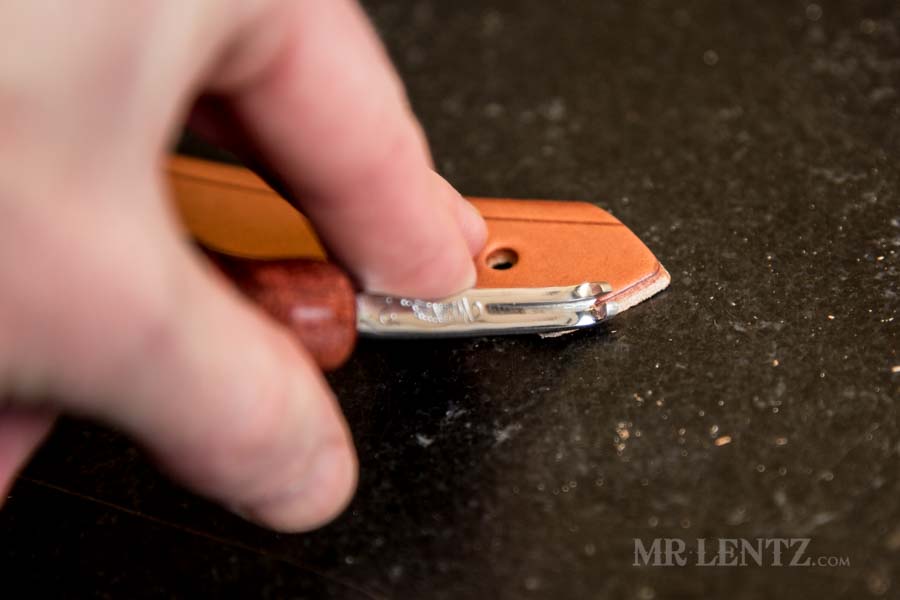 beveling the edge of retaining strap