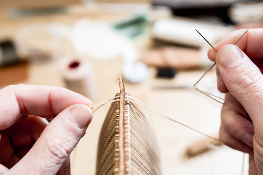 pulling thread through leather for saddle stitch