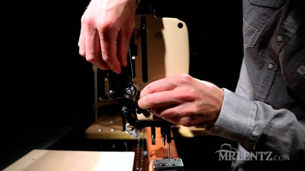feeding thread through the side of a leather sewing machine