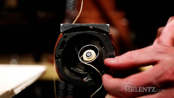 inserting the bobbing thread on a leather sewing machine