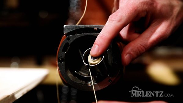 pulling bobbin thread through tension in leather sewing machine