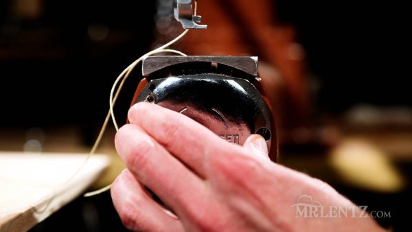 closing the cover plate on the leather sewing machine