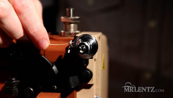 thread tensioner for top tension