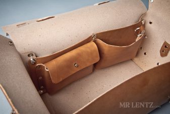 pockets of open leather duffel bag