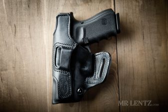 backside of glock leather holster with tension screw