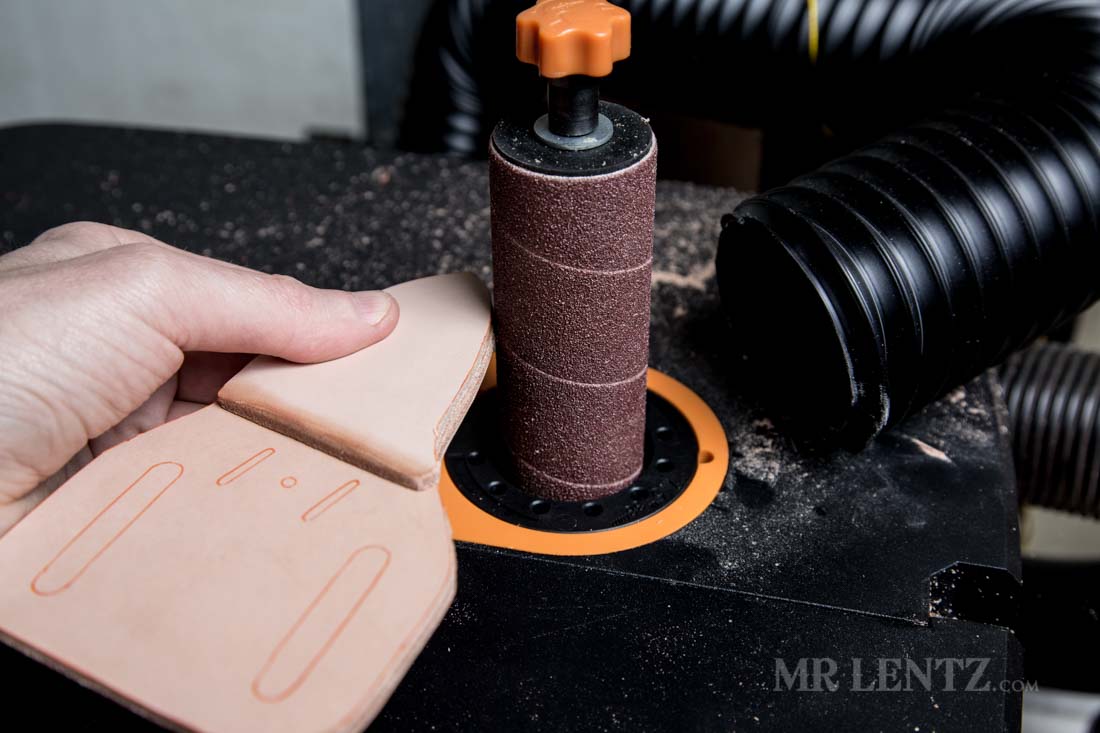 sanding the edge of leather knife sheath