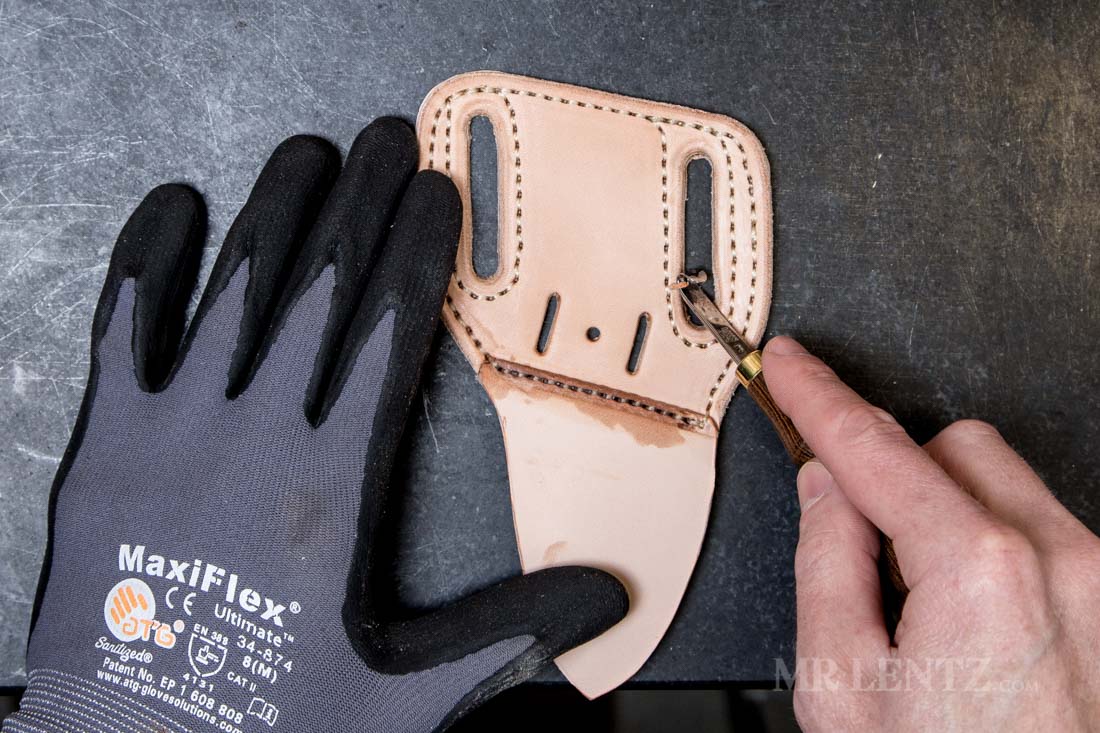 beveling the belt slots on a leather knife sheath
