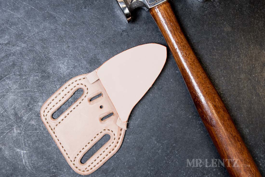 hammering down the final layer of a knife sheath