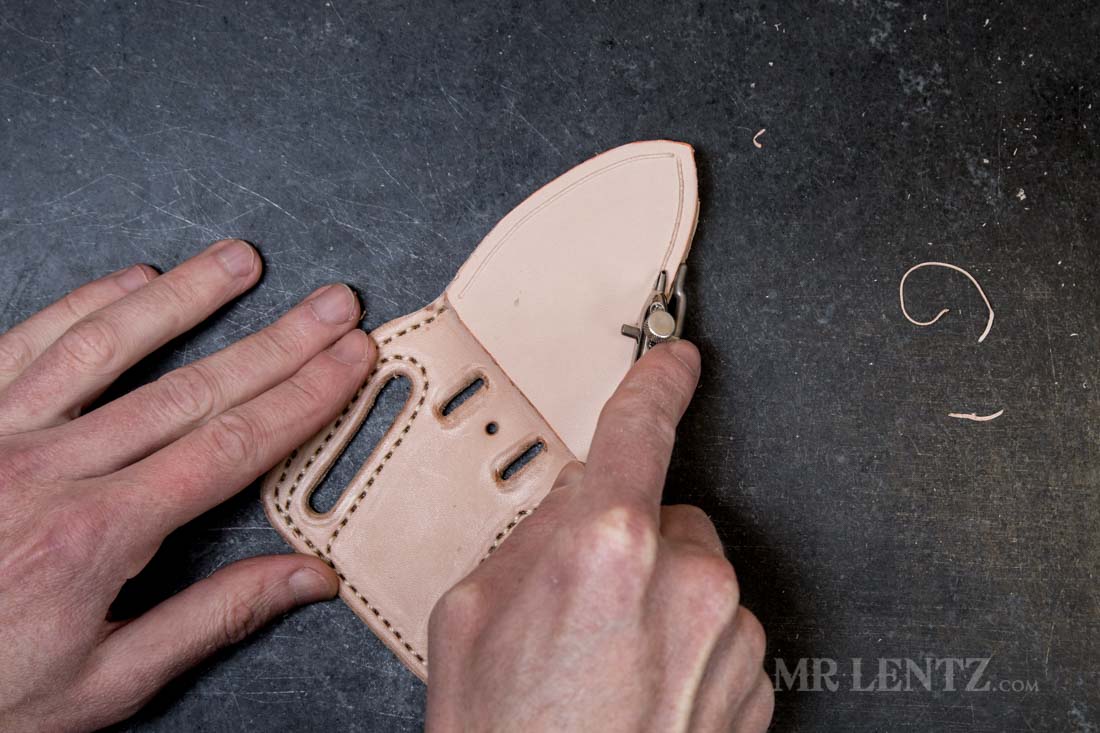 using a stitch groover on leather knife sheath
