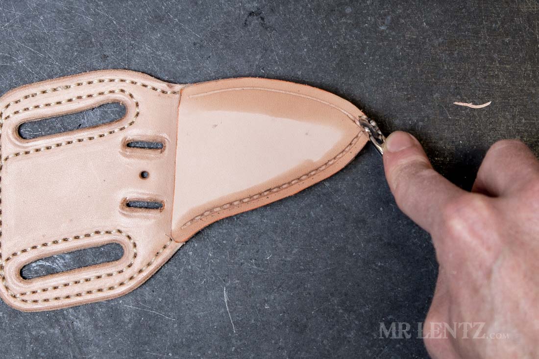 using the stitch marking tool on the leather sheath