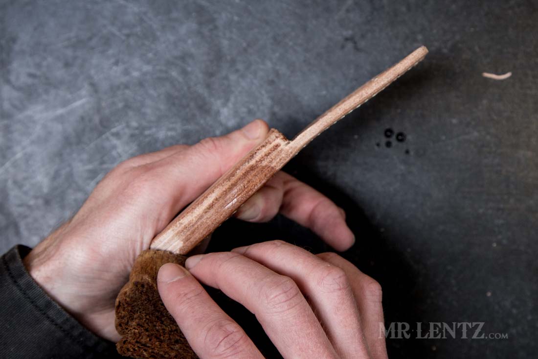 wetting the edge of a thick leather knife sheath