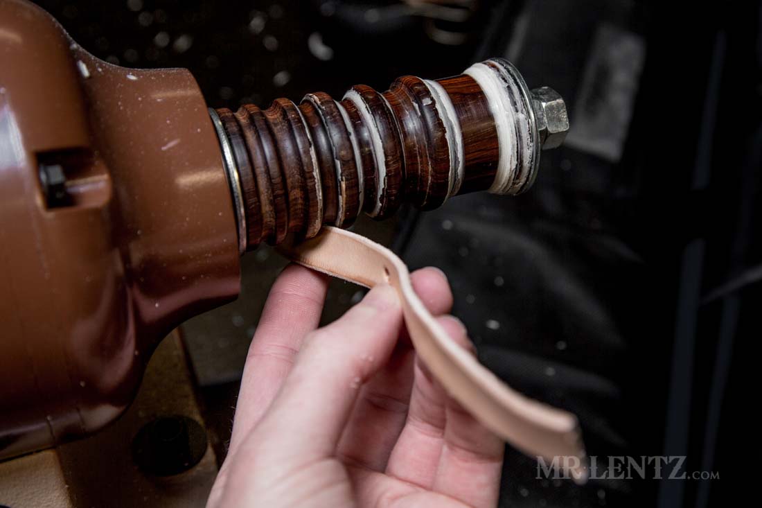 burnishing the edge of a retaining strap on a knife sheath