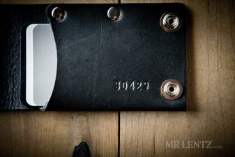 closeup of black leather snap wallet