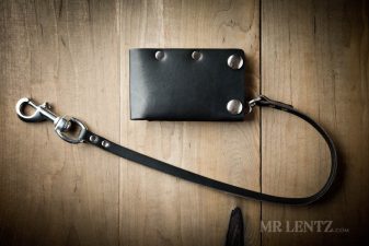 black snap card wallet with leather chain