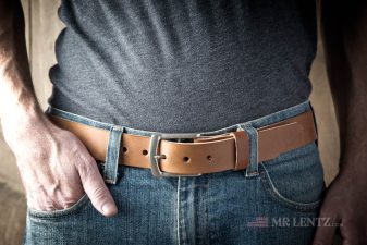 wearing a brown leather gun belt