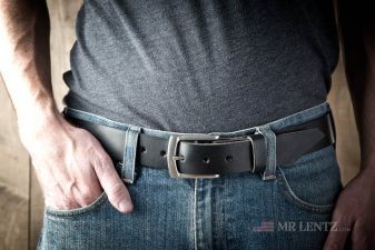 wearing black leather gun belt