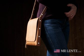 wearing a brown slim crossbody bag