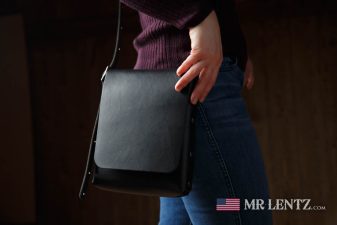 wearing a black slim crossbody purse
