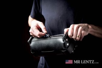 opening a black sling bag fanny pack