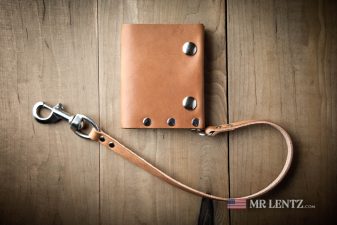 leather chain on trifold snap wallet in brown