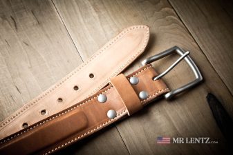 front and back of a brown leather dress belt