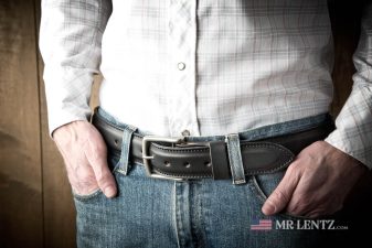 wearing a wide black dress belt